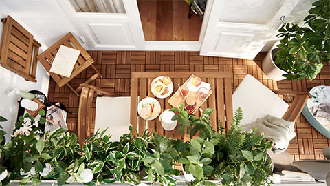 A small wood-and-greenery balcony with room for both laundry and leisure