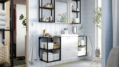 A shared bathroom with a simple look and  lots of storage
