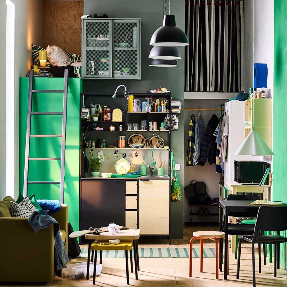 Freestanding ÄSPINGE kitchenette in black/ ash in green student accommodation.